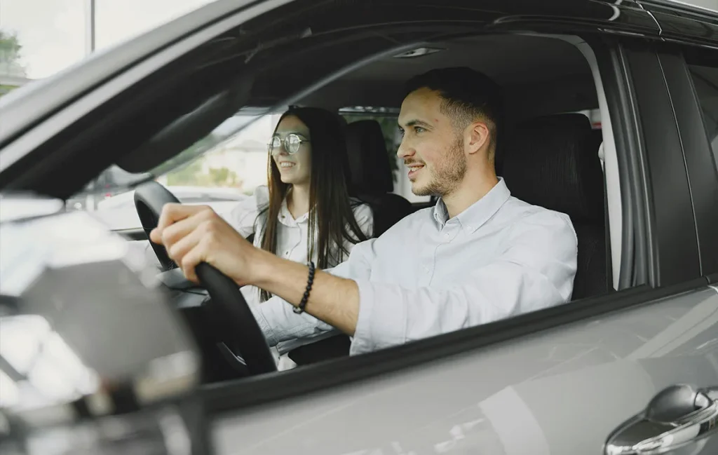Young drivers learning about car insurance for new drivers while driving in Texas