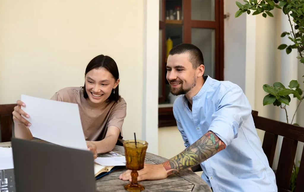 A young couple evaluating personal property items to figure out how much is renters insurance in texas.