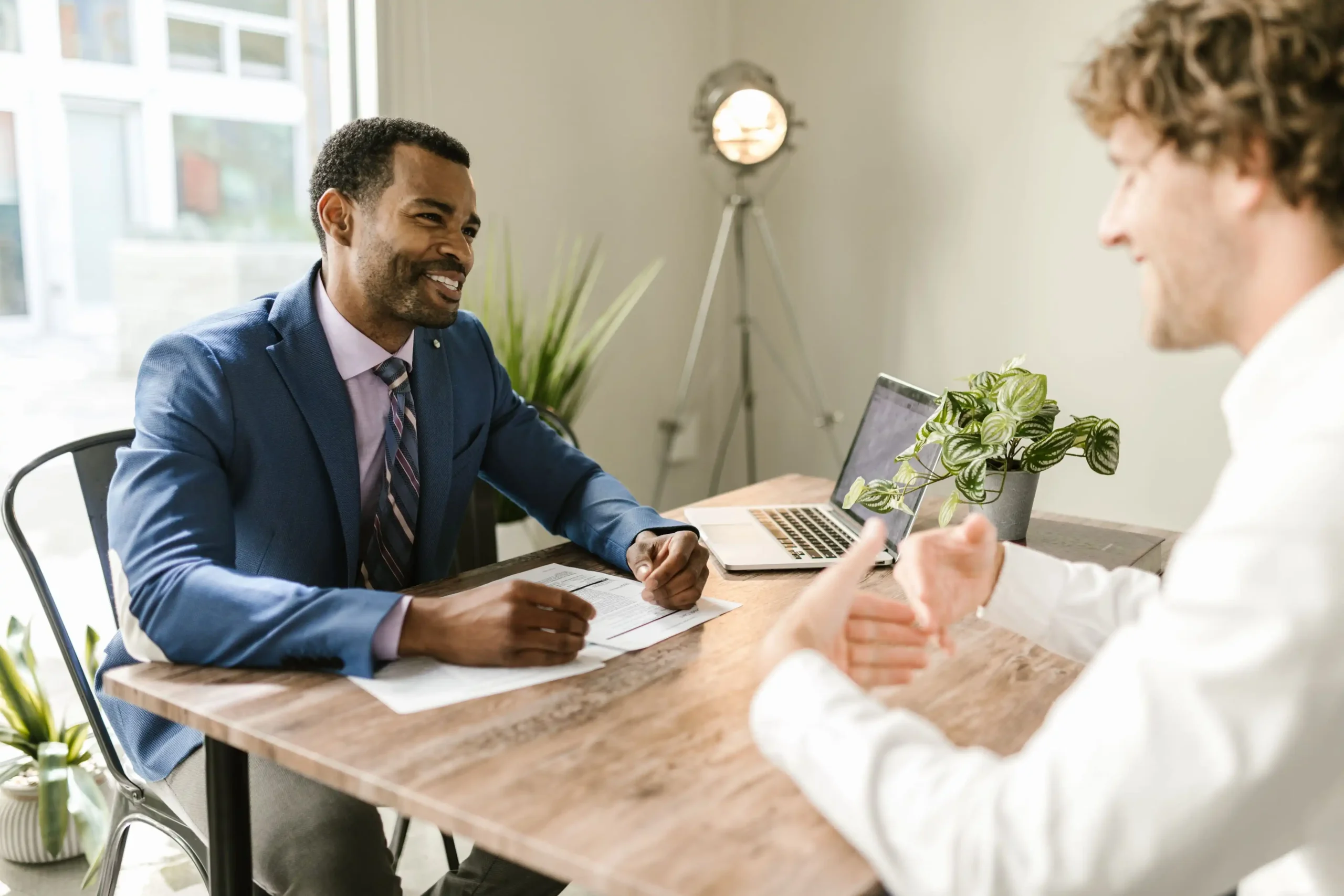 Local insurance agent discussing auto insurance options with a customer
